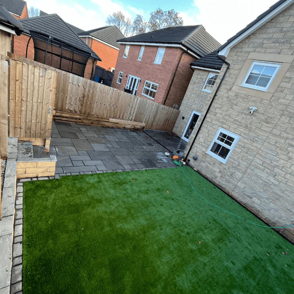 Artificial grass and indian stone finish